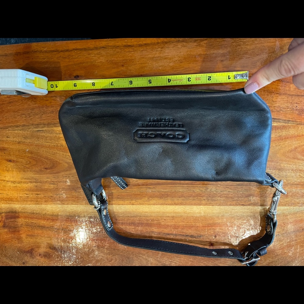 Coach mini bag. Black leather. Great shape zipper closes and opens no issues.